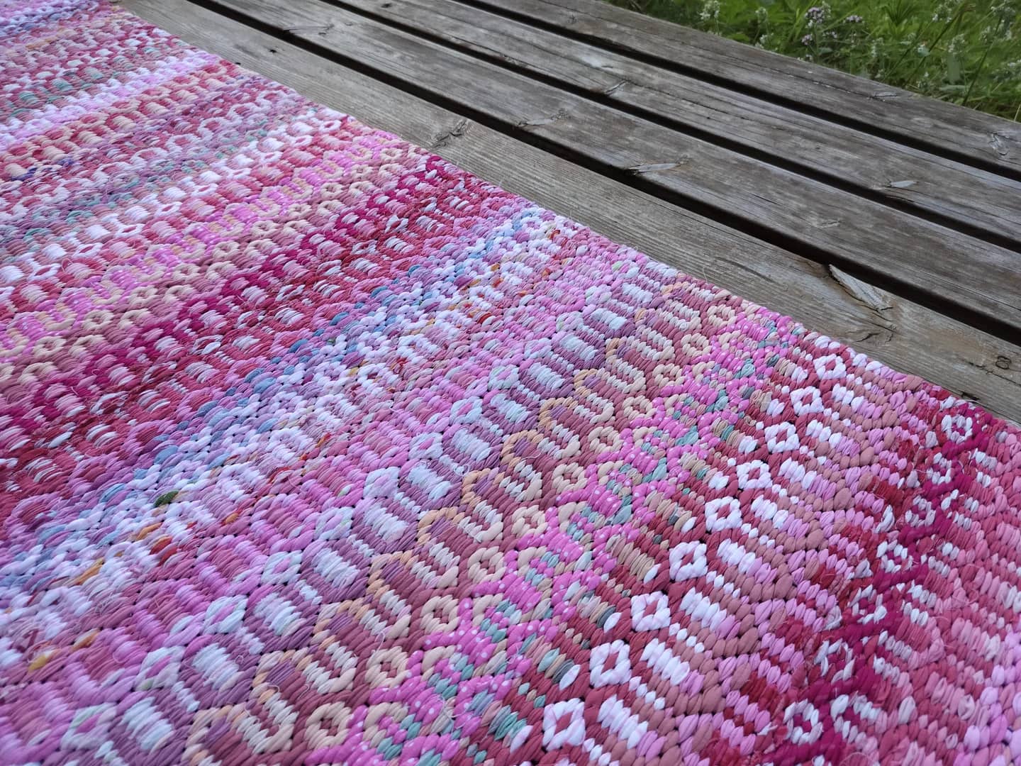 Close-up of handwoven texture in warm tones.